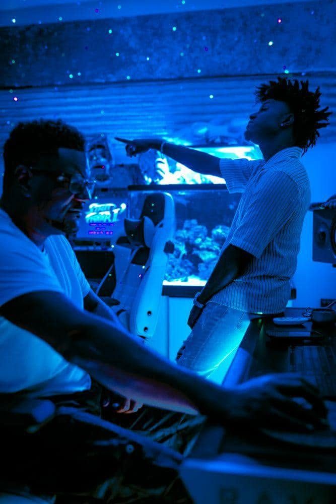 Keyz Bridgez in a blue-lit studio session