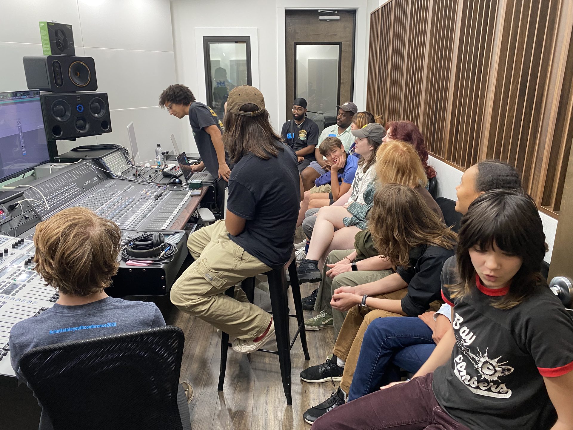 Young creators in a recording studio control room